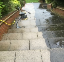 Paved steps being jet washed