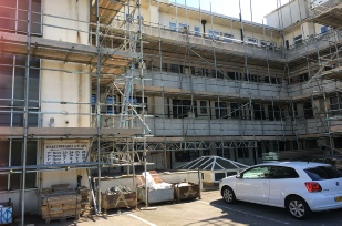 Building being renoved with scaffolding before work to clean it
