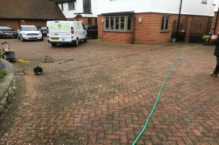 Dirty block paved area before being cleaned