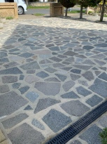 Crazy-paved area clean after being jet washed